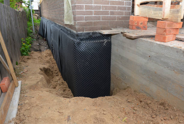 SJ Waterproofing Pros technician performing targeted Exterior Waterproofing assessment in Wyatt, IN